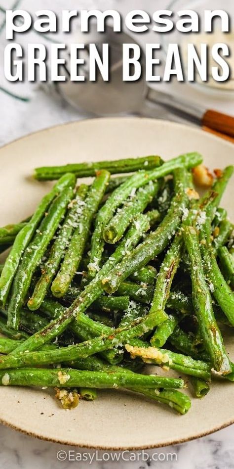 Crispy and flavorful these oven roasted green beans are the perfect side dish with almost any meal. In this recipe, green beans are tossed with some garlic, seasonings, oil, and parmesan cheese. Then they are baked in the oven until the parmesan is melted and the beans are cooked and ready for serving. #ovenroastedgreenbeans #greenbeansinoven #parmesangreenbeans #easylowcarb Green Bean Recipes Oven, Roasted Frozen Green Beans, French Green Bean Recipes, Recipe Green Beans, Green Beans Garlic, Oven Green Beans, Balsamic Green Beans, Fresh Green Bean Recipes, Grilled Green Beans