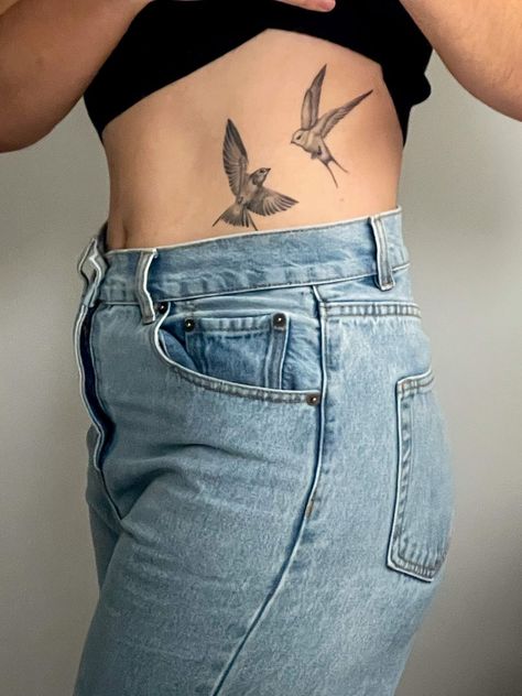 Explore the beauty of birds with these unique bird tattoo ideas perfect for nature lovers. From delicate hummingbirds to majestic eagles, find inspiration for your next bird tattoo here. Bird Rip Tattoo, Bird Ribcage Tattoo, Bird Tattoo On Hip, Bird And Vine Tattoo, Bird Knee Tattoo, Bird Tattoo On Ribs, Bird Rib Tattoo, Bird In Flight Tattoo, Bird Back Tattoo