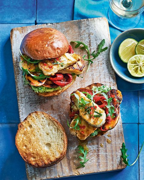 Slices of halloumi and sweet potato are marinated, grilled and placed in burger buns spread with a generous amount of smashed avocado. That's vegetarian barbecuing done right. Sweet Potato Burgers, Taco Pizza, Smashed Avocado, Delicious Magazine, Mashed Avocado, Burger Buns, Kebabs, Avocado Recipes, Veggie Burger