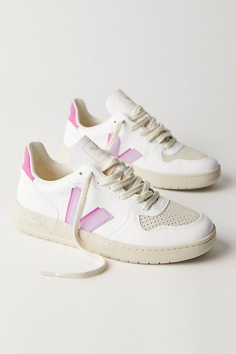 Made from sustainable materials, these retro-style leather sneakers feature colorful details and a logo on the side. * Padded collar and footbed * Low-top style * Textured rubber sole **VEJA** VEJA sneakers are made using fair trade principles and are composed of raw and wild materials sourced from organic farming and ecological agriculture, without chemicals or pollutants. They work directly with the Seringueiro community in the Amazon Rainforest to harvest wild rubber, which is used in the sole of every VEJA sneaker. Each pair of VEJA sneakers is produced in the same factory in the state of Rio Grande do Sul in southern Brazil. | Veja V-10 Sneakers at Free People in Purple, Size: EU 39 Organization Shoes, Shoes Dressing, Dressing Shoes, Shoe Outfits, Storage Shoes, Shoe Organization, Shoes Dresses, Trends Shoes, Veja V 10