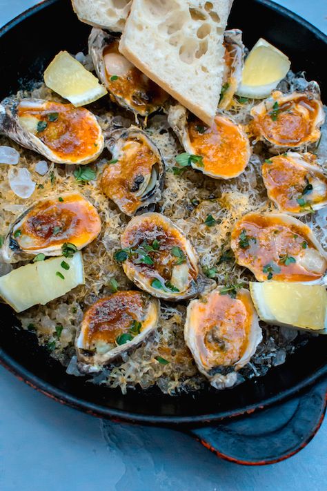 Charbroiled Oysters with Garlic Butter and Parmesan Charbroiled Oysters Recipe, Chargrilled Oysters Recipe, Moqueca Recipe, Charbroiled Oysters, Brazilian Fish Stew, Steamed Clams, Grilled Oysters, Oyster Roast, Spiced Butter