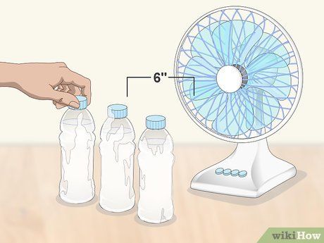 Image titled Make an Easy Homemade Air Conditioner from a Fan and Water Bottles Step 3 Homemade Air Conditioner, Natural Air Conditioner, Diy Air Conditioner, Heat Fan, Bottle Images, Diy Fan, Portable Air Conditioner, Camping Tips, Hacks Diy