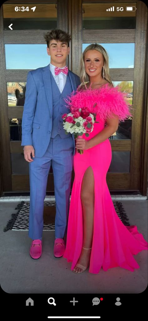 Bright Prom Dresses 2023, Hot Pink Pageant Dress, Hot Pink Prom Dress With Feathers, Hot Pink Prom Outfits For Couples, Hot Pink Prom Dress With Gray Suit, Prom Date Color Ideas, Fuschia Prom Couple, Hot Pink Dresses Prom, Flowers To Go With Hot Pink Prom Dress