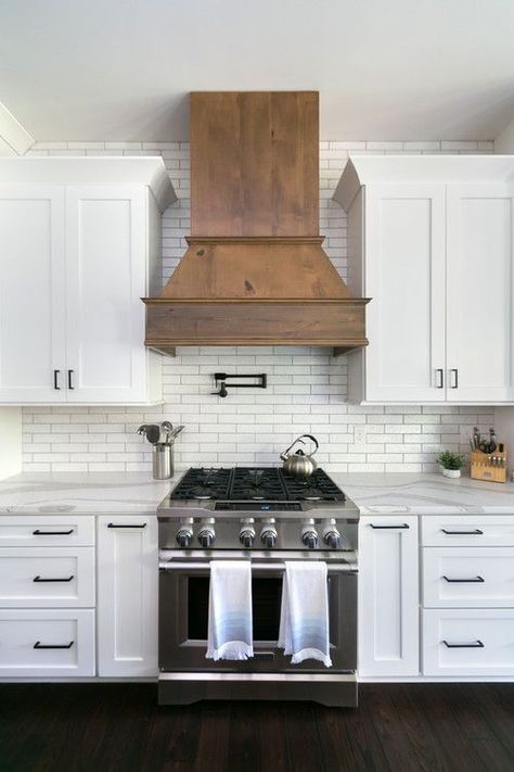 White and Wood Modern Farmhouse Kitchen with White Cabinets and Wood Range Hood #kitchen #kitchendecor #kitchendecorideas #kitchendecorating #kitchendecoratingideas #farmhousekitchen #modernfarmhousekitchen #whitekitchens #modernfarmhouse #farmhouse #farmhousedecor Pipe Shelving, White Cupboards, Wood Range Hood, Modern Farmhouse Kitchen, Farmhouse Kitchen Cabinets, Investment Properties, Kitchen Hoods, New Kitchen Cabinets, Vent Hood