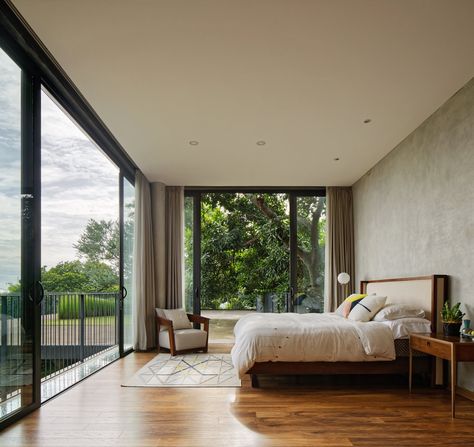 This Concrete Abode Embraces Indonesia's Tropical Climate - Photo 6 of 12 - The bedroom on the second floor has a treehouse-like feel. Architect Bedroom, Modern Tropical Bedroom, Modern Tropical Interior, Outside Bedroom, Space Home Decor, Tropical Interior Design, Modern Tropical House, Tropical House Design, Tropical Interior