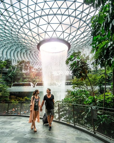 SINGAPORE IS FULL OF WONDERS . Have you already seen the Jewel, guys? This place feels like you were in a sci-fi 😅 Could totally spend there a whole day, but we had only an hour before our flight ✈️  #tropicexplorers #earthcouples #visitsingapore #travelpassport #themoderndayexplorer #traveladdicted #couplesgoals #goexplore #bestplacestogo #exploresingapore #doyoutravel #whpplanetearth #singaporeairport #whpgoingplaces #changiairport #lovesingapore #amazingsingapore #jewelchangiairport The Jewel Singapore, Jewel Changi Airport Photoshoot, Singapore Moodboard, Greenhouse Landscape, Jewel Singapore, Jewel Changi Airport, Changi Airport Singapore, Singapore Vacation, Honeymoon Photography