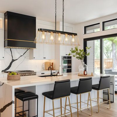 This five-light kitchen island pendant lamp is made of sturdy iron and features a contrasting finish in deep gold and matte black, which not only enhances its rust and corrosion resistance but also ensures durability and long-term aesthetic appeal. Its simple and elegant design incorporates an open metal framework that stabilizes the structure while allowing light to freely penetrate, effectively enhancing the spatial layering and visual impact to create a warm atmosphere. Whether in an industri Black And Gold Hardware Kitchen, Gold Hardware Kitchen, Rectangle Kitchen Island, Kitchen Island Square, Lights Over Island, Rectangle Kitchen, Kitchen Island Pendant, Kitchen Decor Modern, Kitchen Island Pendants