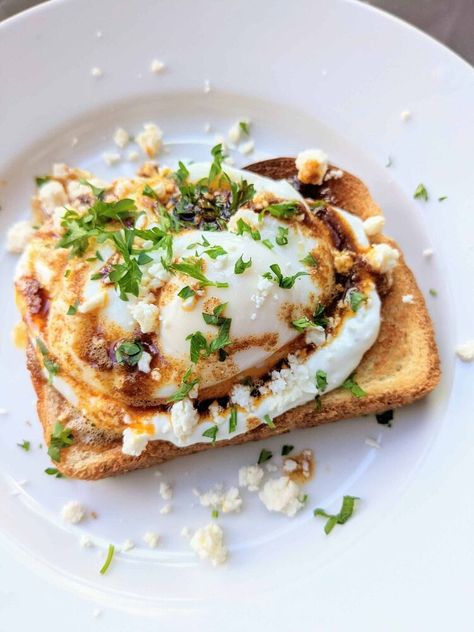 So you've heard of Turkish eggs before, but today it is Turkish toast! This is mainly because I didn’t have any pita bread and I’m trying to work with whatever I have in my fridge / freezer. Essentially it is the exact same idea, just served on a piece of toast! This is a perfect one-person meal and the flavor is so impressive for how easy it is to make.Poaching eggs can be difficult for some so a fried egg works just as well! My favorite way to poach an egg is by bringing a pot of wat… Turkish Eggs On Toast, Breakfast Toast Recipes, Poaching Eggs, Poach An Egg, Turkish Eggs, One Person Meals, Pita Bread Recipe, Organic Restaurant, Turkish Breakfast