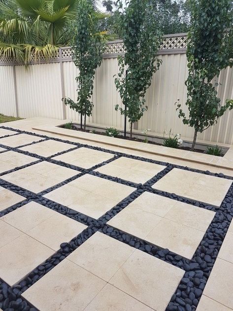 Pavers With Pebbles In Between, Pavers And Pebbles Patio, Patio With Large Pavers, Black Pavers Patio, Black Pebbles Landscape, Modern Pavers Backyard, Black Pebble Landscaping, Garden Pebbles Landscaping, Backyard Cement Ideas