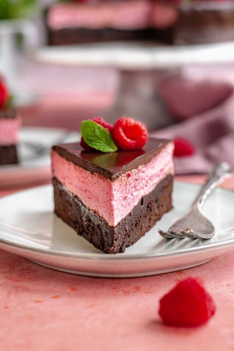 This layered raspberry mousse cake has a chewy chocolate brownie cake layer, light and fresh raspberry mousse, and gets covered in a glossy dark chocolate ganache. It's the perfect cake for Valentine's Day or a special gathering and is sure to please a crowd! Chocolate Raspberry Mousse Cake, Chewy Chocolate Brownies, Chocolate Ganache Glaze, Raspberry Mousse Cake, Chocolate Brownie Cake, Raspberry Mousse, Brownie Cake, Mousse Cake, Cake Cover