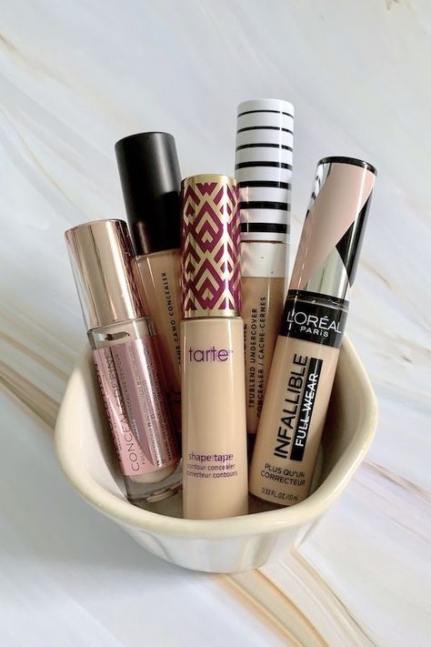 Cult beauty favorite Tarte Shape Tape Contour Concealer is highly pigmented and it covers without creasing or cracking. I put four drugstore concealers to the test to see if they could be dupes for Shape Tape. #makeup #concealer #tarte #tartecosmetics #drugstore #concealer #concealerdupes Loreal Concealer, Concealer Tarte, Rosa Make-up, Tape Makeup, Koleksi Makeup, Contour Concealer, Drugstore Concealer, Makeup Favorites, Shape Tape Concealer