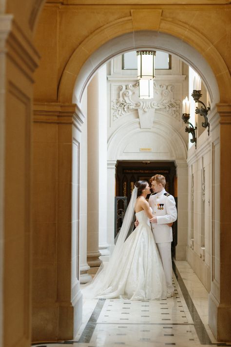 Annapolis US Naval Academy | Maryland Wedding | By Brittany Branson | This US Naval Academy Chapel bride and groom enjoy a private moment after their wedding ceremony in this photo by Michelle Landreau of Morninglight Photography. Often times, wedding photographers take outdoor wedding pictures of the couple, but this indoor wedding picture is timeless and the architecture surrounding them is absolutely beautiful. Their religious, military wedding is one to remember! #marylandwedding #military Us Navy Wedding Ideas, Naval Officer Wedding, Us Navy Wedding, Royalty Wedding Theme, Naval Academy Wedding, Indoor Wedding Inspiration, Outdoor Wedding Pictures, Indoor Wedding Photos, Military Weddings