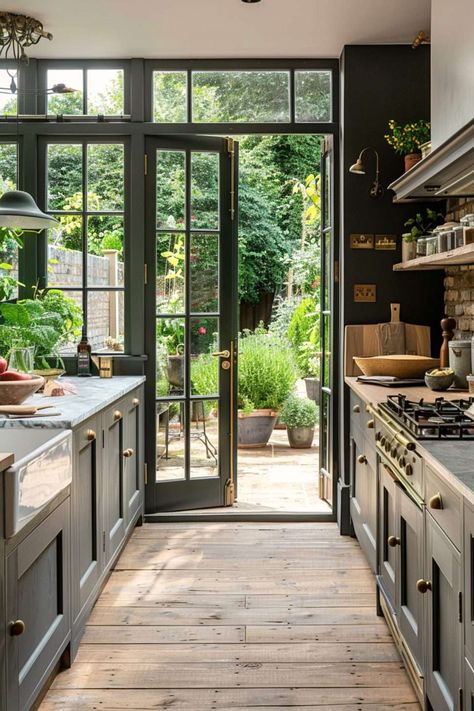 Greenhouse Inspired Kitchen, Kitchen Connected To Garden, Glass Enclosed Kitchen, Atrium Kitchen Extension, Kitchen With Doors To Outside, Atrium House Indoor, Kitchen Solarium, Atrium Addition, Inside Outside Kitchen