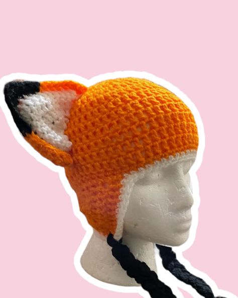 Snuggle up with our Fox Beanie! Featuring adorable fox ears and cozy warmth, it’s the perfect accessory to add a touch of playful charm to any outfit. #supportblackbusiness #crochetdesigns #blackcreatives #supportblackart #blackentrepreneurs #buysmallbusiness #crochetlove #crochetart #crochethandmade #yarnlove #stitchcraft #crochetcreations #crochetcraft #crochetersofinstagram #croche #yarn #yarnaddict #crochetofinstagram #crochet Crochet Fox Hat, Crocheted Fox, Fox Beanie, Fox Hat, Black Entrepreneurs, Autumn Fairy, Support Black Business, Fox Ears, Crochet Beanie