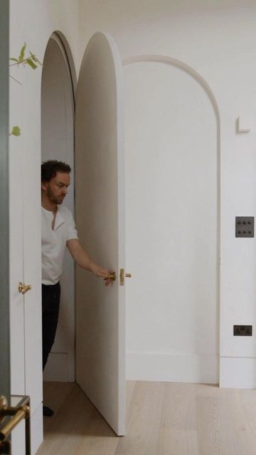 HUTCH on Instagram: "Making an entrance… the secret arched door that disappears in to the wall. Left ‘open’ to bring light through the home, create views and frame the entrance, a clever way to welcome guests in to your house. Captured by @wilsonarcherfilms⁠, custom designed by @hutch.design and made by PM Construction. –– #HUTCH #homesbyHUTCH #luxuryhomes #luxurydesign #naturalmaterials #naturallight #barrelvault #modernliving #architecture #interiors #hiddendoor #secretdoor #arch #slowliving #calm #serene #relaxinghome" Arch Hidden Door, Arch Doors, Arched Doors, Secret Door, Beauty Clinic, Bathroom Door, Hidden Door, Architecture Interiors, Bathroom Doors