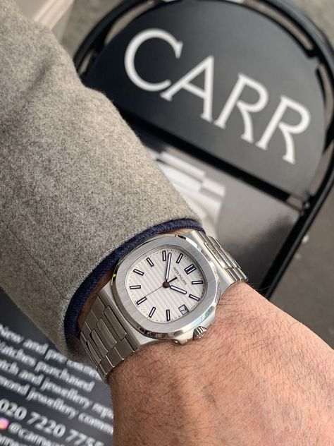 Check out the beautiful Patek Philippe Nautilus White Watch. An elegant watch for men. Very casual watch for special occasions, but also can be worn as a sports watch for men. #luxurywatch #luxurywatches #omega #daydate #patek #audemars #panerai #cartier #hublot #breitling #iwc #horology #blancpain #orologi #richardmille #watchesoftheday #timepiece Patek Phillipe Watch, Movado Watches, Elegant Watch, White Dial Watch, Movado Watch, Patek Philippe Watches, Patek Philippe Aquanaut, White Watch, Watch For Men