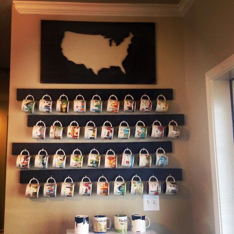 Coffee Mug Display  1x4's black paint C shaped screw hooks  I had Lowe's cut the wood the size I desired.  Then I painted each board black.  Waited it to dry and screwed in the hooks.  I then screwed the boards directly in the wall to make sure they were stable.  I ordered the map from https://www.etsy.com/shop/wrightawaydesigns.    Perfect for a Coffee Bar or to show off your collection. Mug Display Ideas, Cup Display, Coffee Mug Display, Mug Storage, Coffee Urn, Interior Design Blogs, Coffee Mug Holder, Starbucks Mug, Mug Display