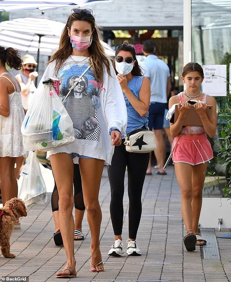 Legs for days: Alessandra's top swallowed up her jean shorts and highlighted her long, tan... Kurt Cobain Shirt, Tanned Legs, Tan Legs, Wear A Mask, Style Finder, Alessandra Ambrosio, Light Turquoise, Edgy Look, Kurt Cobain