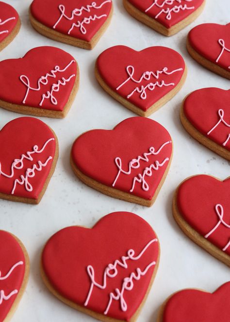 Tell someone how you feel with our sweet iced vanilla Valentine's Love You Heart biscuits. Available in red or pink, each biscuit is hand iced, piped and decorated. Biscuits come individually packaged in cellophane and finished with ribbon. Priced per individual biscuit. Available to order for UK-wide shipping or to collect from our store in Claygate, Surrey. Biscuits can be collected any day during opening hours until Sunday 13th February. Valentine's Weekend opening hours are Friday 11th Febru Valentine’s Day Biscuits, Valentines Day Biscuits, Sugar Cookie Hearts, Sugar Cookies Valentines Day, Valentine’s Day Sugar Cookies, Valentines Sugar Cookies Decorated, Valentine’s Day Cookies, Valentines Day Cookies Decorated, Valentines Biscuits