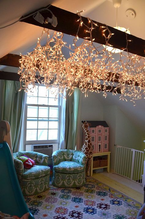 I took advantage of the after Christmas sales and stocked up on icicle lights... then I nailed them across some exposed beams in our playroom to give the whole… Loft Playroom, Rec Rooms, Flower Room Decor, After Christmas Sales, Fairy Lights Decor, Christmas Light Installation, Hanging Christmas Lights, Christmas Sales, Fairy Lights Bedroom