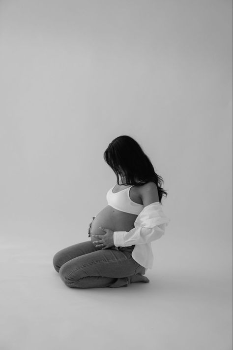 Elegant maternity photos captured in black and white within the setting of a professional studio. All images belong to ajphotography760. Email: ajphotography760@gmail.com Studio Maternity Shoot Diy, Tommy Hilfiger Maternity Shoot, Maternity Portraits Indoor, Maternity Photos On Film, Black And White Studio Maternity Shoot, Button Up Maternity Photos, Maternity Shoot Bodysuit, Belly Out Maternity Photos, Maternity Poses Indoor