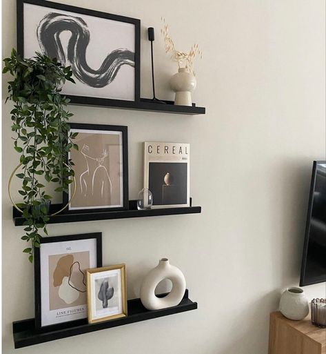 Salon Suite Decor Wall Shelves, Black And Beige Shelf Decor, Behind The Desk Decor, Black Floating Shelves Hallway, How To Design Shelves, Black Wall Shelves Living Room, Floating Black Shelves Living Room, Black Floating Shelf Decor, Black Floating Shelves Bedroom