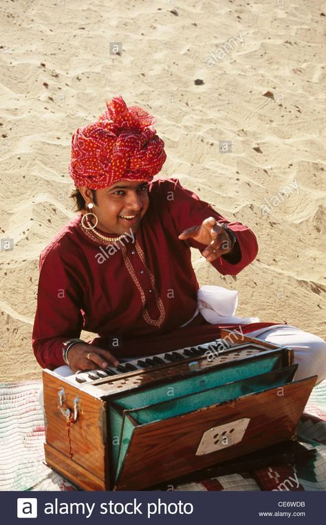 Download this stock image: BDR 83380 : indian rajasthani folk musician singing and playing musical instrument harmonium rajasthan india MR Indian Instruments, Indian Musical Instruments, Folk Musician, Event Entertainment, Figure Poses, Rajasthan India, Bollywood Celebrities, Musical Instrument, Classical Music