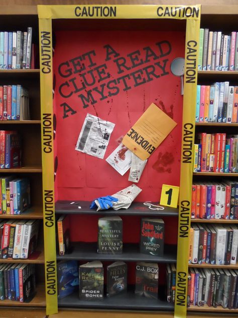 Great mystery display! Could take out more shelves and make a body outline! School Library Book Displays, School Library Lessons, Get A Clue, School Library Decor, Photoshoot Magazine, Reading Display, School Library Displays, Teen Library, Middle School Libraries