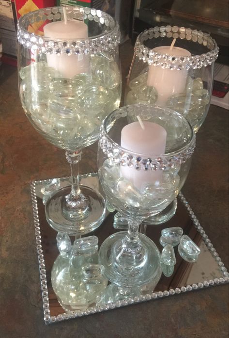 I wanted a unique centerpiece for my dining room table. I had an idea if what i wanted but ciuldnt find it. I decided to use wine glasses and decorate them so I could create exactly what I wanted. Kimmy Creations, Centerpieces With Wine Glasses, Wedding Reception Candles, Dollar Tree Candle Holders, Wine Glass Centerpieces, Glass Table Decor, Dining Room Table Centerpiece, 90th Birthday Decorations, Fish Nets