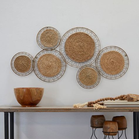 "Get the Brown Dried Plant Handmade Woven Plate Wall Decor with Intricate Patterns 40\" x 2\" x 21\" at Michaels. com. Give your home a personalize touch and bring your creative vision to life. Decorate with ease with our eclectic range of home decor. Decorate with fun with Iris And Ivory A boho inspired style that exudes creative form with a free-spirited design. Bohemian wall art is made of durable iron and dried plant fiber. Abstract geometric wall art features naturally textured brown rope f Woven Wall Decor, Woven Decor, Plate Wall Decor, Bohemian Wall Art, Wood Plate, Geometric Wall Decor, Plate Wall, Round Wall Art, Dry Plants