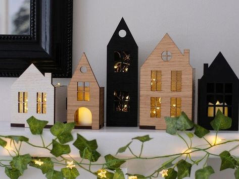 Design beautiful laser cut Christmas decor featuring ornament templates and place settings. Perfect for adding a touch of handmade charm to your holiday home or as unique gifts. Village Vibes, Scandinavian Hygge, Wooden House Design, Art 2023, Set Decoration, Wooden Houses, Led Candle, Christmas Villages, Miniature Houses