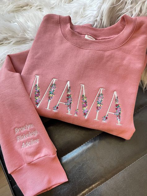 MAMA Floral Crewneck Sweatshirt with Children Names Sleeve Embroidery Custom Gift Soft and cozy, 9oz cotton with poly thread 90/10 cotton poly *shown in mauve Gildan or Hanes brand Comfort Colors and Bella available with custom listing and slight price increase. Mama Embroidery Sweatshirt, Embroidered Grandma Sweatshirt, Mama Sweatshirt With Names, Embroidery Designs On Sweatshirts, Embroidery Business Names, Embroidery Shirt Ideas, Sleeve Embroidery Designs, Machine Embroidery Inspiration, Embroidered Sweatshirt Ideas