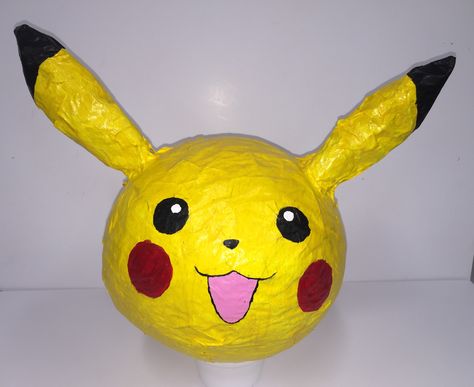 Paper Mache Pikachu Pikachu Surprise, Surprise Pikachu, Surprise Pokemon, Paper Mache Pinata, Paper Mache Crafts For Kids, Pikachu Hat, Halloween Pinata, Pokemon Jewelry, Paper Mache Projects