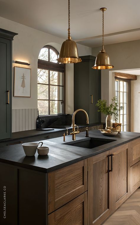 If you’re looking for a kitchen design that screams timeless sophistication, black and wood cabinets are the ultimate power duo. The contrast of sleek black with the warmth of natural wood creates a modern-yet-classic vibe that works for any style.   In this article to black and wood kitchen cabinets, learn how top pair black lower cabinets with warm wooden uppers for a balanced look, or go bold with an all-black island surrounded by wood tones. Add brass or matte black hardware for an extra touch of elegance, and finish with subtle accents like textured backsplash tiles or open wood shelving.   This kitchen trend trend is perfect for anyone who wants a bold and inviting space—hello, dream kitchen goals! Wooden Kitchen With Black Countertop, Black Kitchen With Brass Hardware, Light Dark Kitchen, Kitchen With Dark Trim, Cozy Dark Kitchen, Black Countertop Wood Cabinets, Black Lower Cabinets Wood Upper, Black And Wood Cabinets, Black And Natural Wood Kitchen