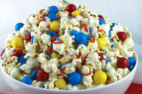 This Celebration Popcorn is sweet, salty, delicious colorful and chock full of crunchy colorful chocolate candy. This fun popcorn dessert would be a treat for a Beach Ball Pool Party, a Circus Party, a Curious George Party, a Superhero Party or a Sesame Street Party. Pin this easy to make snack for later and follow us for more fun Popcorn recipe ideas. #Popcorn #SummerTreat #PopcornRecipe Beach Ball Pool Party, Fun Popcorn, Wonder Woman Birthday Party, Women Party Ideas, Curious George Birthday Party, Superhero Party Decorations, Wonder Woman Party, Curious George Party, Superhero Baby Shower