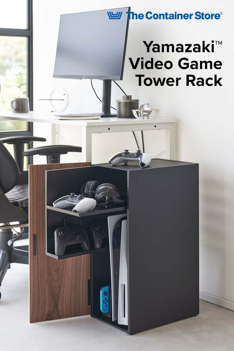 Transform your gaming space with the Yamazaki Game Room Storage Cabinet, designed to organize your gaming gear. This all-in-one cabinet features two spacious pull-out shelves, perfect for storing consoles, controllers, and accessories, keeping your gaming area tidy. The elegant wooden front panel, magnetic closure, and minimalist steel exterior blend seamlessly with any living room or game room décor, adding a refined touch to your setup. Game Room Storage, Video Game Console Storage, Game Console Storage, Gaming Area, Gaming Space, Pull Out Shelves, Console Storage, The Container Store, Cabinet Features