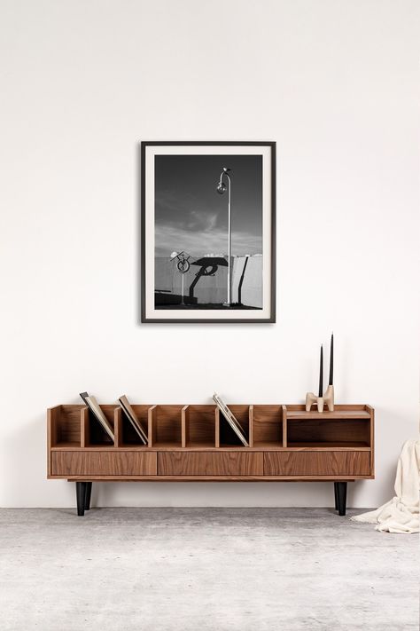 Open low cabinet for vinyls, record player and books: POPPY - Combination of Style and Functionality Materials used: - material: American walnut veneer - legs: wooden Dimensions - Width to choose from: 150, 160, 170, 180, 190 cm - Depth: 43 cm - Height without legs: 38 cm Legs to choose from - Round wooden or black (height 18 cm) - Diagonal wooden or black (height 18 cm) - Plinth (height 4 cm) Our furniture is shipped completely with legs and handles removed. Assembly is very simple and takes no Vinyl Records Storage, Scandinavian Tv Stand, Vinyl Cabinet, Long Tv Stand, Records Storage, Midcentury Tv Stand, Shelf Arrangement, Loft Stil, Book Cabinet