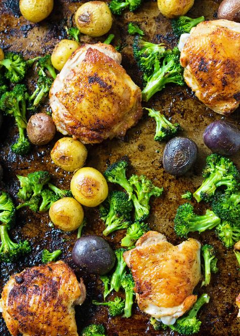 Sheet pan chicken with roasted potatoes and broccoli! Everything cooks together on one baking sheet - so EASY. Use chicken thighs for tender, juicy results every time. Roasted Potatoes And Broccoli, Potatoes And Broccoli, Broccoli And Potatoes, Sheet Pan Suppers, Sheet Pan Chicken, Roasted Chicken Thighs, Chicken Thigh Recipes Oven, Chicken Thigh Recipes Crockpot, Chicken Thigh Recipes Baked