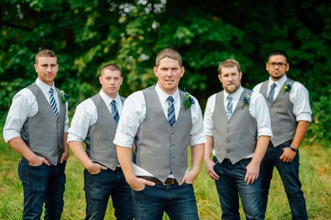 Gray vest, blue jeans groomsmen Dark Jeans Groomsmen, Gray Vest With Jeans Wedding, Blue Jeans And Vest Wedding Grooms, Grey Vest And Jeans Groomsmen, Grey Suit Jacket With Jeans Wedding, Blue Jeans Groomsmen, Groom Vest And Jeans, Dusty Blue Groomsmen Attire Jeans, Gray Vest Groomsmen