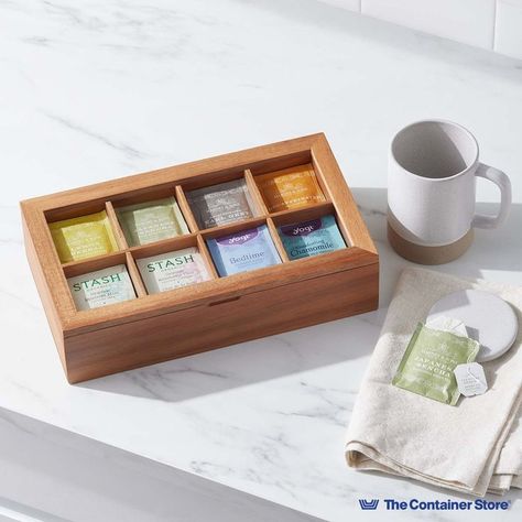 With a refined look that blends natural beauty and everyday functionality, this teabag organizer brings order to countertops and beverage bars. It's crafted from sustainably sourced acacia wood, with a window-like top that keeps contents visible. Inside, eight compartments can organize and store teabags, as well as coffee pods, sweetener packets and other everyday essentials. You'll love how this box can travel to the table when needed for tea time. Essentials Wishlist, Small Drawer Organizer, Tea Box Design, Deep Drawer Organization, Tea Organizer, Junk Drawer Organizing, Spice Organization Drawer, Utensil Drawer Organization, Kitchen Drawer Organizers