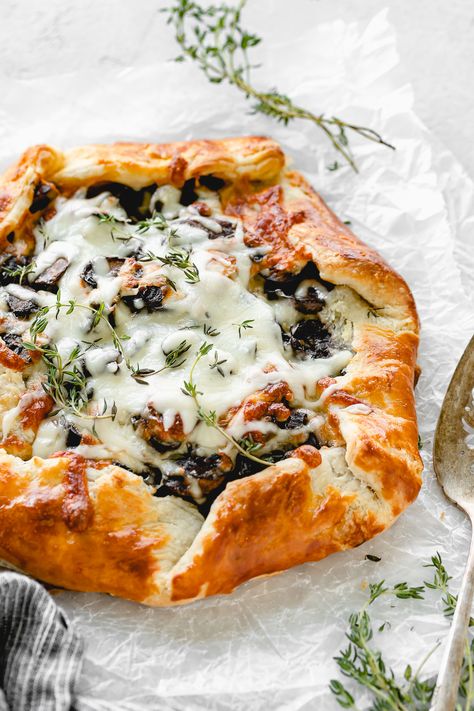 Beautiful Mushroom, Onion and Thyme Galette! I love the gorgeous rustic look of a freeform galette! Filled with mushrooms, thyme and shredded mozzarella cheese, this is rewarding to make and eat! Galette Recipe Savory, Galette Recipe, Savory Tart, Tasty Vegetarian Recipes, Savoury Baking, Puff Pastry Recipes, Fresh Thyme, Shredded Mozzarella, Mushroom Recipes