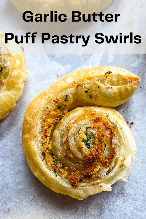 Garlic butter puff pastry swirl on a sheet pan. Garlic Puff Pastry Recipes, Garlic Bread Puff Pastry, Puff Pastry Garlic Knots, Garlic Cheese Puff Pastry, Garlic Puff Pastry, Puff Pastry Garlic Twists, Butter Puff Pastry Recipes, Puff Pastry Garlic Bread, Parmesan Puffs