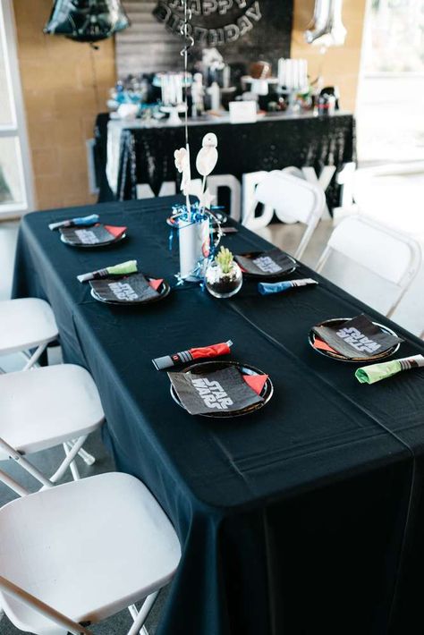 The Force is Strong with Maddox | CatchMyParty.com Starwars Birthday Table Decor, Starwars Birthday Centerpieces, Star Wars Tablescape, Star Wars Party Centerpieces, Star Wars Table Decorations, Galaxy Birthday Party Ideas, Star Wars Table, Darth Vader Party, Galaxy Birthday Party