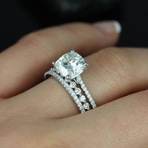 We are loving the mix and match stackable band trend! Check out this subtle shared prong band setting off the gorgeous cushion center stone and marching band. Like? ❤️ #padisbride #engagementring #bling #weddingband #weddingbands #diamonds #whitegold #jewels #engaged #wedding #jewelry #platinum #sfbride #shoplocal #round #sopretty #jewelrygram #jewelryaddict #loveislove #sparkle #theknot #ido Bling Rings, Dream Ring, St Michael, Bridal Sets, Morganite, Cushion Cut, Moissanite Engagement, Bling Bling, Ring Verlobung