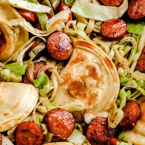 Fried Cabbage and Sausage Skillet with Pierogis Pierogi Cabbage And Sausage, Pierogies Cabbage And Kielbasa, Pierogies And Cabbage, Cabbage Perogies Sausage, Kielbasa Cabbage And Pierogies, Pierogies And Sausage Recipes, Cabbage And Pierogies, Cabbage And Perogies, Kelbeisa Sausage And Cabbage