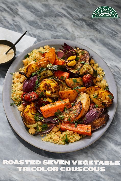 Imagine a tastier way to get your daily serving of vegetables. Inject some serious flavor into your daily fix with a savory symphony of seven roasted vegetables on a soft bed of fluffy, colorful couscous. #RiceSelect #UnforgettableMeals #SpontaneousBrilliance #CouscousRecipes #DinnerRecipes Couscous With Roasted Vegetables, Vegetable Couscous Recipes, Roasted Vegetable Couscous, Couscous Dishes, Grains Recipes, Moroccan Vegetables, Vegetable Couscous, Healthy Dinner Recipe, Roasted Vegetable Recipes