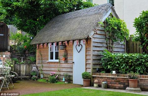 This she shed owner has gone for the Olde English Garden touch with their thatched rood and Union Jack bunting Shed Of The Year, Cheap Sheds, Shed Plan, Wooden Sheds, Backyard Shed, Potting Sheds, Thatched Roof, She Sheds, Shed Design