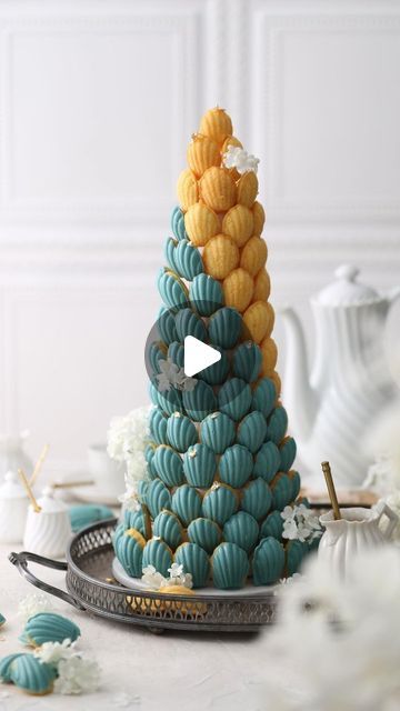 ADIL AMAICH  | Vegan No-Bake Recipes on Instagram: "🌿😋 // Turquoise Madeleine Tower 🏰✨ | A Symbol of Elegance and Mystery 💛🩵

🌿 Which of your friends needs the recipe for this amazing vegan dessert? Tag them! 📣💬

🌿 Follow 👉 @vegansweetss for an array of healthy and easy vegan recipes that support weight loss and overall well-being

🌿 Follow By : @chloe_laics

🌿 Don't forget to tag a friend who would adore these recipes!

🌿 Wishing you all a fantastic evening! ❤️
♡
♡
♡
♡
♡
♡
♡
♡
♡
♡
♡
♡
♡
#Turquoir #madewithlove #madeleine #dessert #foodstyling #sweets #cakeinspo #bakinglove #instayum #instagood #caketrends #reels #chocolate #chocolatey #sweettreats #treats #turquoise" Madeleine Tower, Easy Vegan Recipes, Cake Trends, Vegan Dessert, Cake Decor, Easy Vegan, Vegan Desserts, Tag A Friend, No Bake