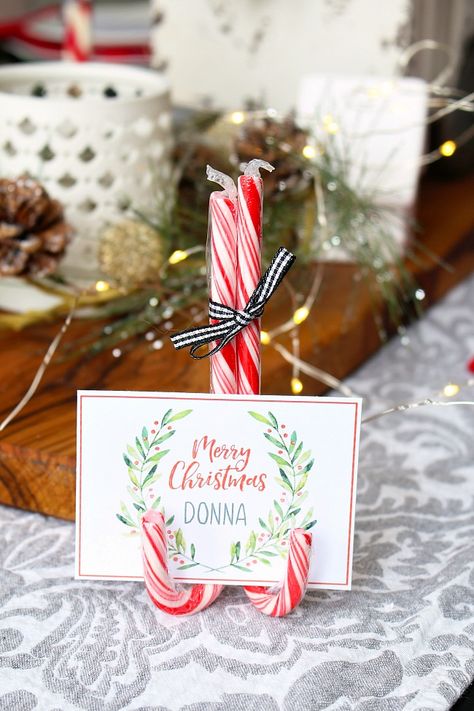 Dress up your table this holiday season with these free printable Christmas place cards and DIY candy cane place card stand. Printable Christmas Place Cards, Christmas Place Card Holders, Christmas Place Setting, Diy Candy Cane, Christmas Place Settings, Place Setting Cards, Christmas Name Tags, Christmas Place Cards, Deco Table Noel