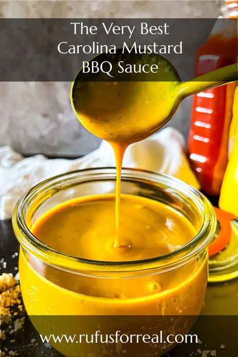 picture of a jar of deep yellow Carolina mustard sauce drizzled from above by a spoon South Carolina Mustard Bbq Sauce, Mustard Bbq Sauce Recipe South Carolina, Carolina Barbecue Sauce Recipe, Mustard Barbecue Sauce Recipe, Mustard Based Bbq Sauce Recipes, Royal Farms Chesapeake Sauce Recipe, No Ketchup Bbq Sauce Recipe, Carolina Bbq Sauce Recipe, Honey Mustard Bbq Sauce